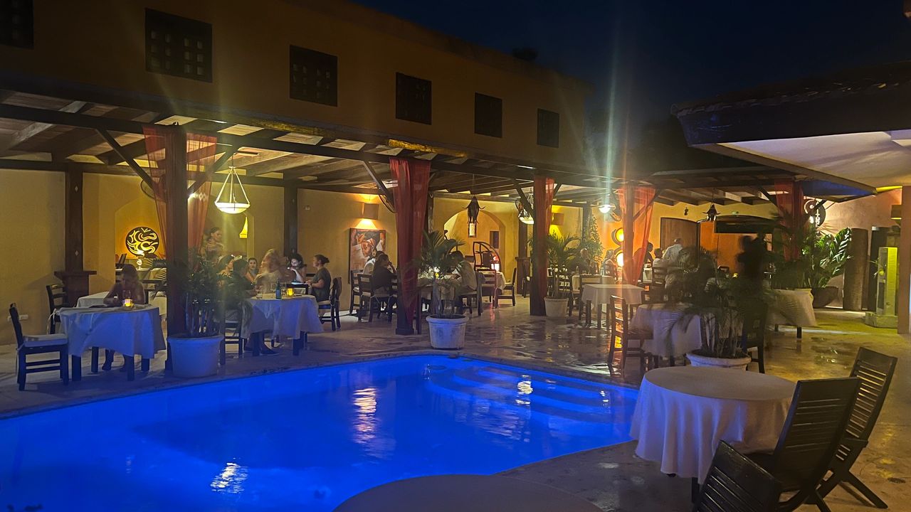 Poolside table dining at Blissy